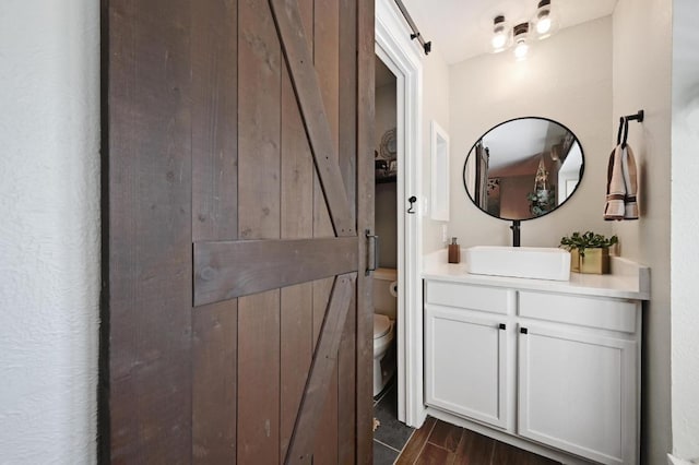 1213 S Trace Dr, Austin, TX 78745 - bathroom with vanity and wood finished floors