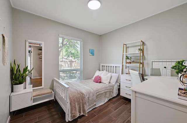 1213 S Trace Dr, Austin, TX 78745 - bedroom featuring baseboards and wood tiled floor