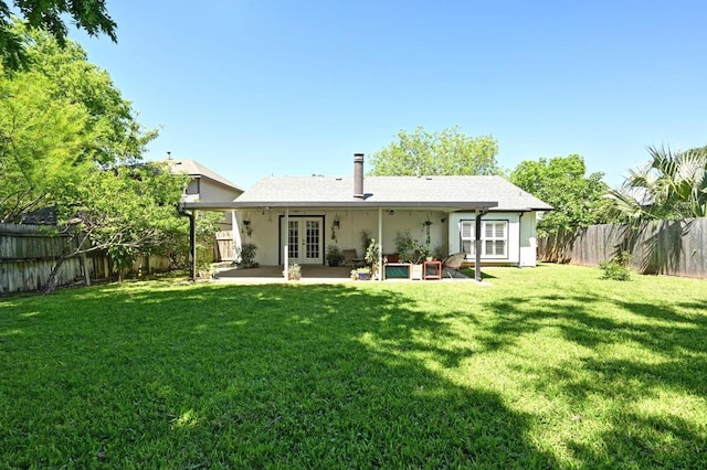 1213 S Trace Dr, Austin, TX 78745 - rear view of property featuring french doors, a fenced backyard, and a patio area
