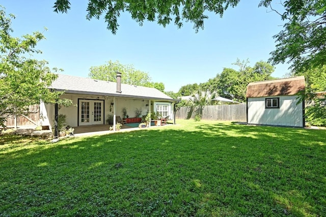 1213 S Trace Dr, Austin, TX 78745 - rear view of house with french doors, a shed, a fenced backyard, and a patio