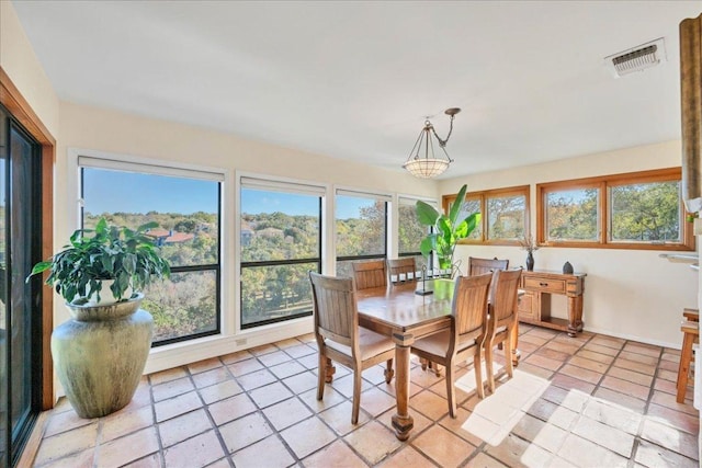dining area with visible vents and light tile patterned floors