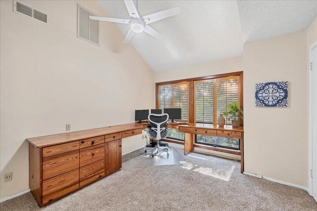 office space featuring visible vents, a ceiling fan, baseboards, and light carpet