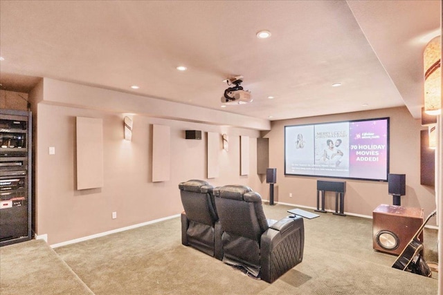 carpeted home theater room with recessed lighting and baseboards