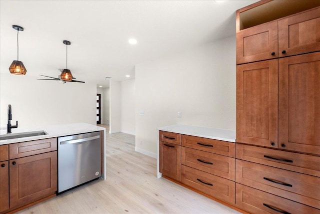 6007 Wideleaf Dr, Austin, TX 78724 - kitchen featuring a sink, light wood-style floors, brown cabinetry, pendant lighting, and dishwasher