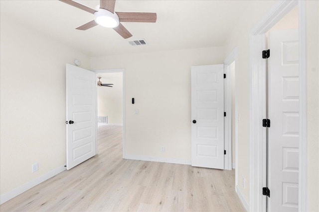 6007 Wideleaf Dr, Austin, TX 78724 - unfurnished bedroom featuring a ceiling fan, visible vents, baseboards, and light wood-type flooring
