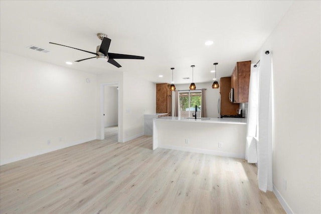6007 Wideleaf Dr, Austin, TX 78724 - unfurnished living room with visible vents, light wood-type flooring, a ceiling fan, and recessed lighting