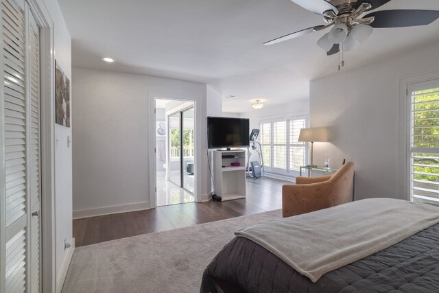 bedroom with baseboards, a ceiling fan, wood finished floors, and recessed lighting