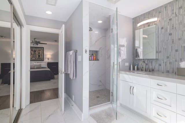 full bathroom with a marble finish shower, visible vents, baseboards, marble finish floor, and connected bathroom