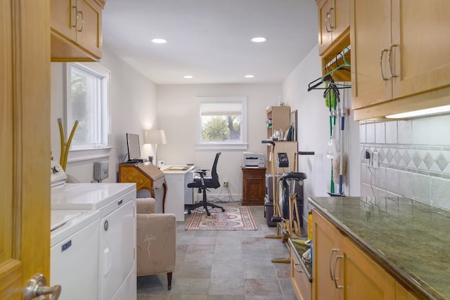 clothes washing area featuring recessed lighting, washer and dryer, and laundry area