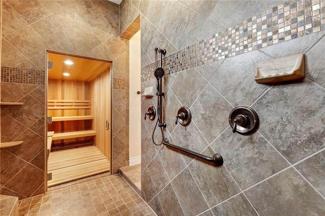 bathroom with walk in shower, built in shelves, and a sauna