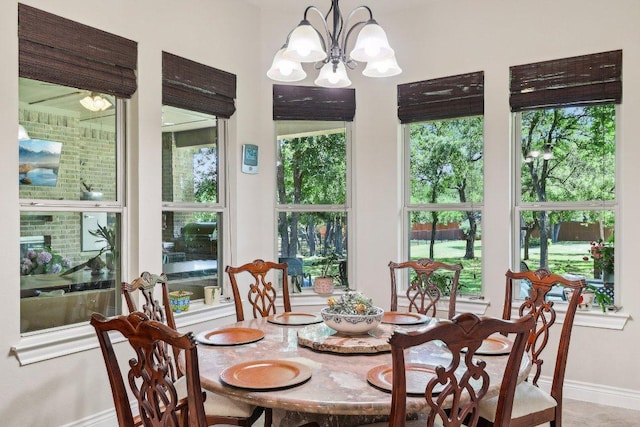 190 Estrella Xing, Georgetown, TX 78628 - dining area featuring baseboards, plenty of natural light, and a chandelier