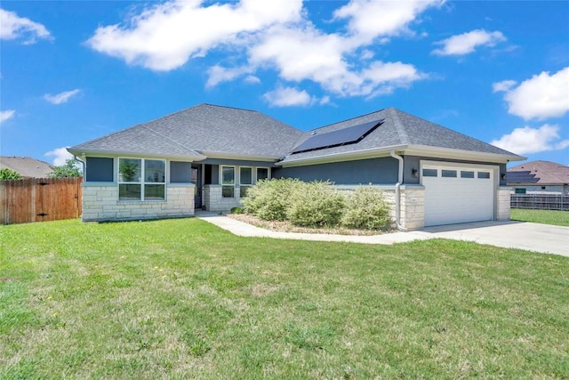 single story home featuring stone siding, fence, driveway, and solar panels
