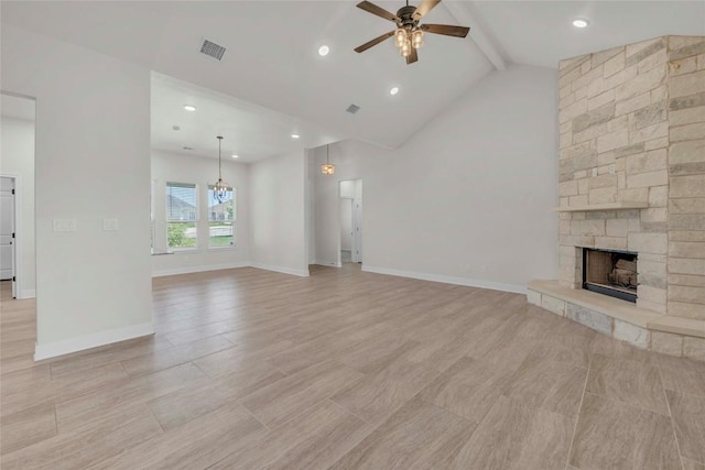 unfurnished living room featuring baseboards, visible vents, ceiling fan, beamed ceiling, and a fireplace