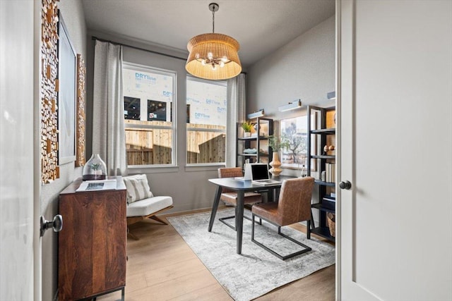 2108 Tobiano Trce, Georgetown, TX 78633 - office with wood finished floors and a chandelier
