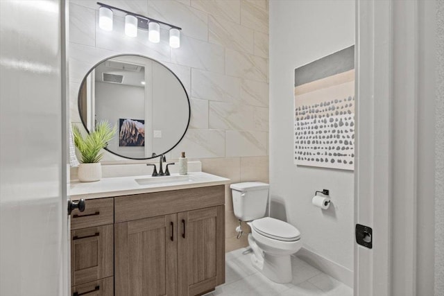 2108 Tobiano Trce, Georgetown, TX 78633 - bathroom with tile walls, vanity, and tile patterned flooring