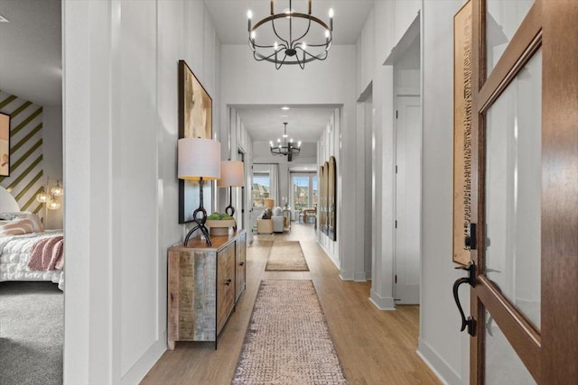 2108 Tobiano Trce, Georgetown, TX 78633 - hall featuring a chandelier and light wood finished floors