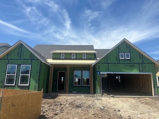 2108 Tobiano Trce, Georgetown, TX 78633 - property in mid-construction featuring a garage, a porch, and a shingled roof