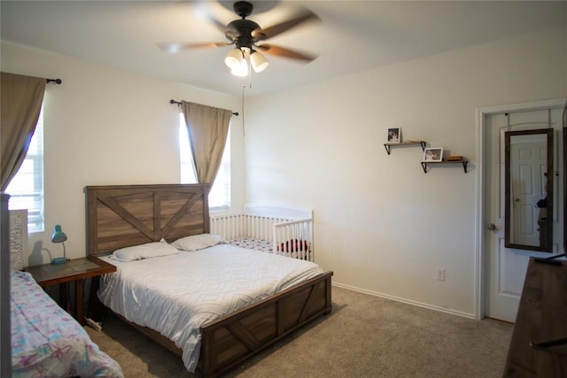 carpeted bedroom featuring a ceiling fan