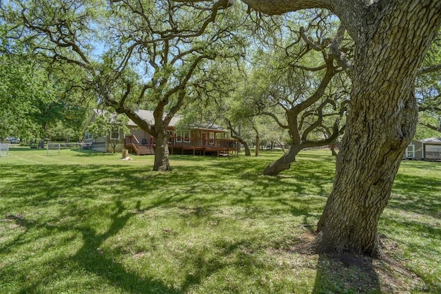view of yard with a wooden deck
