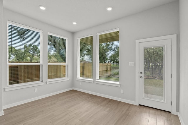 2705 Sage Ranch Dr Unit 30, Leander, TX 78641 - doorway with light wood-style floors, healthy amount of natural light, baseboards, and recessed lighting