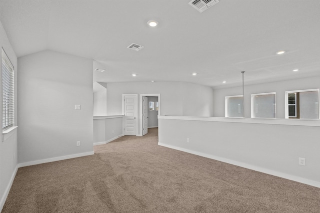 2705 Sage Ranch Dr Unit 30, Leander, TX 78641 - empty room with carpet flooring, plenty of natural light, recessed lighting, baseboards, and lofted ceiling