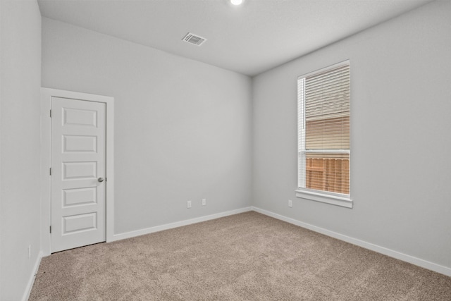 2705 Sage Ranch Dr Unit 30, Leander, TX 78641 - empty room with carpet floors, healthy amount of natural light, and baseboards
