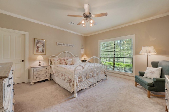 bedroom with visible vents, baseboards, light colored carpet, ceiling fan, and ornamental molding