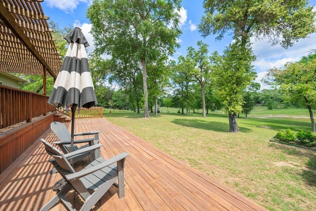 deck with a lawn and a pergola