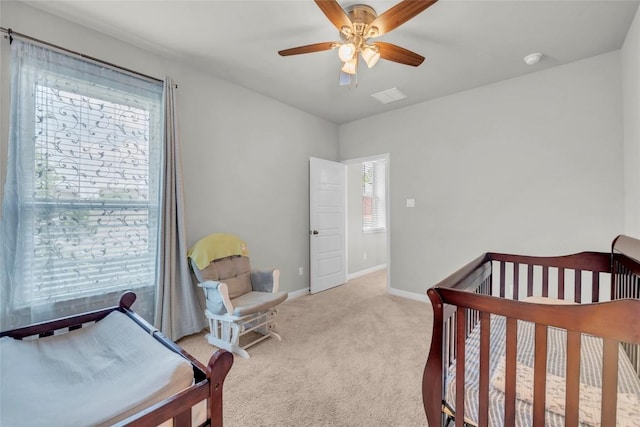 bedroom with light colored carpet, baseboards, a ceiling fan, and visible vents