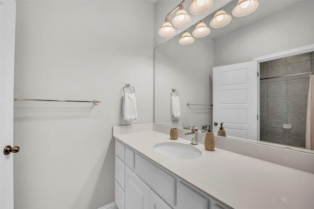 bathroom featuring baseboards and vanity