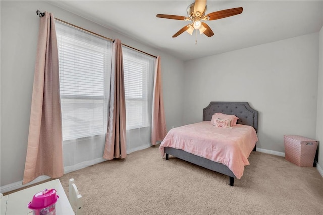 bedroom featuring baseboards, carpet, and ceiling fan