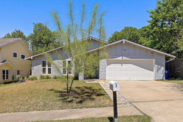 mid-century modern home with a front lawn, concrete driveway, an attached garage, board and batten siding, and brick siding