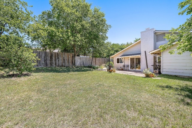 view of yard featuring a patio area and a fenced backyard