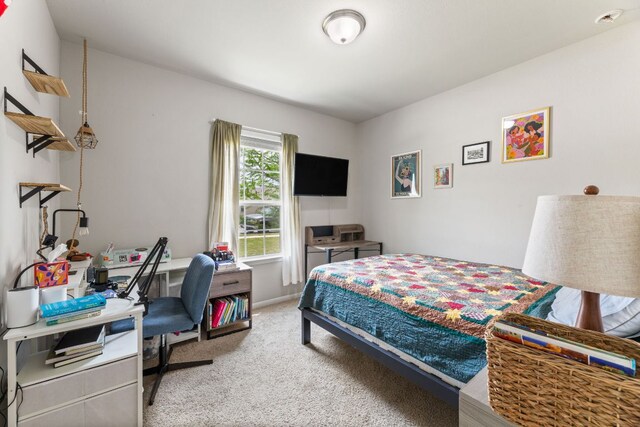 carpeted bedroom with baseboards