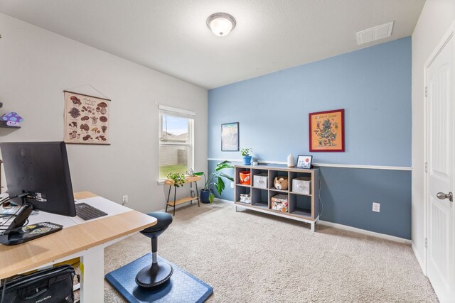 office with baseboards, visible vents, and carpet flooring