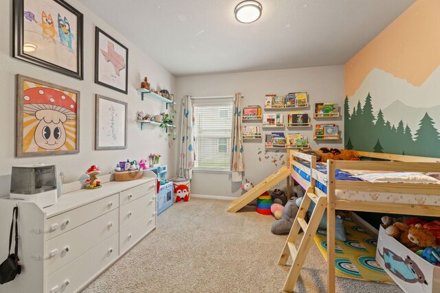 bedroom featuring carpet flooring and baseboards