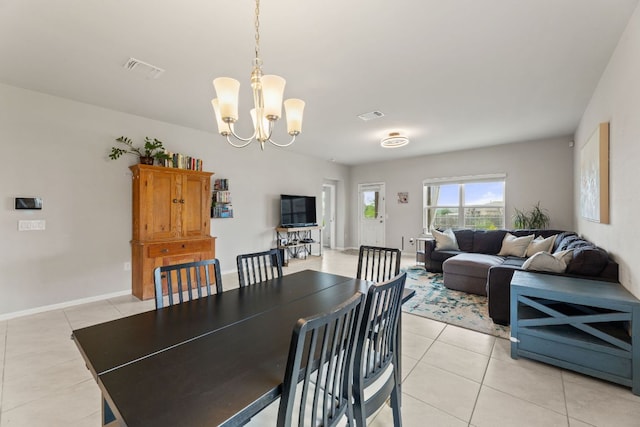 dining room featuring light tile patterned flooring, visible vents, baseboards, and an inviting chandelier