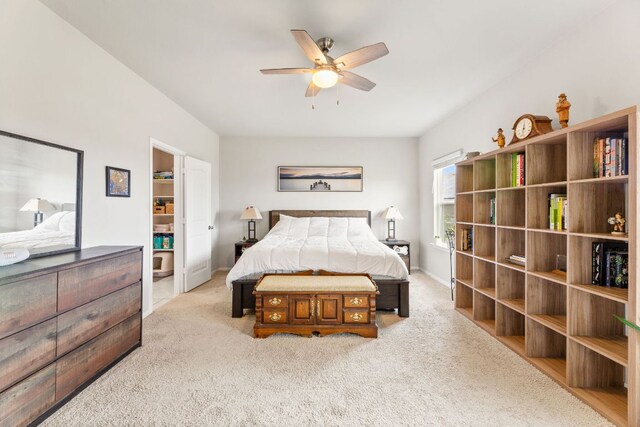 carpeted bedroom featuring baseboards and ceiling fan