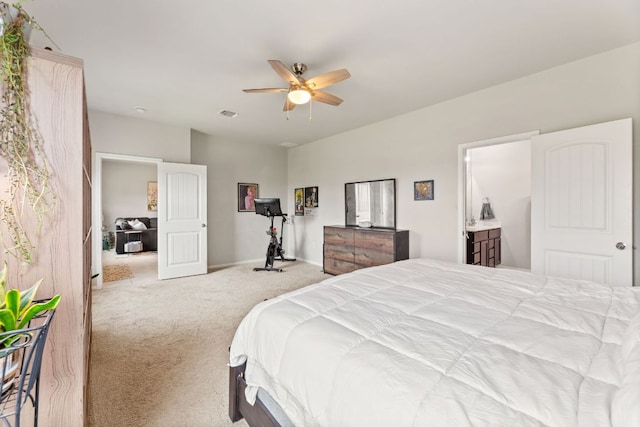 carpeted bedroom with visible vents, a ceiling fan, and baseboards