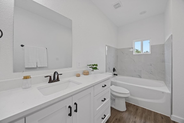 17701 Village Dr, Dripping Springs, TX 78620 - full bathroom with toilet, vanity, and wood finished floors