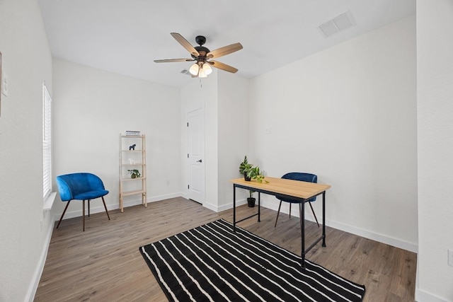 17701 Village Dr, Dripping Springs, TX 78620 - office area featuring wood finished floors, a ceiling fan, and baseboards