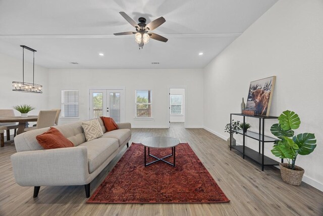 17701 Village Dr, Dripping Springs, TX 78620 - living area with wood finished floors, baseboards, a chandelier, ceiling fan, and recessed lighting