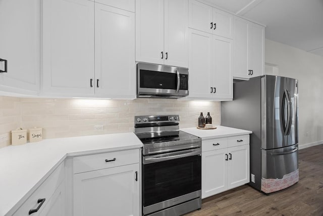 17701 Village Dr, Dripping Springs, TX 78620 - kitchen featuring stainless steel appliances, dark wood-style flooring, light countertops, and white cabinets