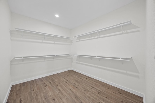 17701 Village Dr, Dripping Springs, TX 78620 - walk in closet featuring wood finished floors