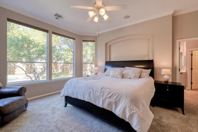 bedroom featuring visible vents, ornamental molding, carpet floors, baseboards, and ceiling fan