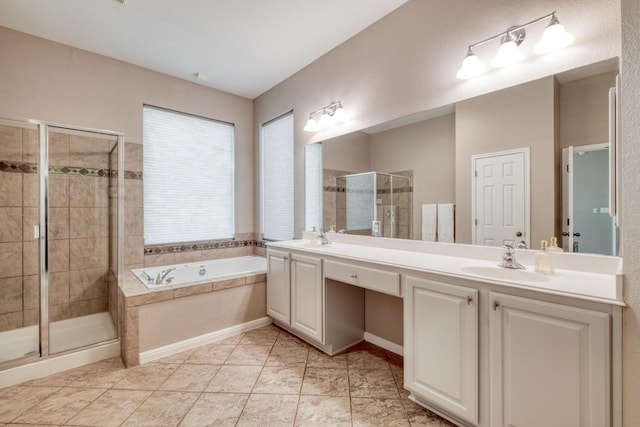 full bath featuring a garden tub, a sink, double vanity, and a stall shower