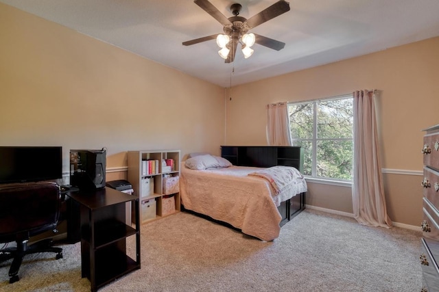 carpeted bedroom with baseboards and ceiling fan