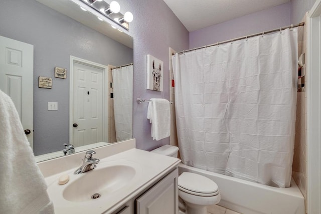 bathroom with a textured wall, toilet, vanity, and shower / bathtub combination with curtain