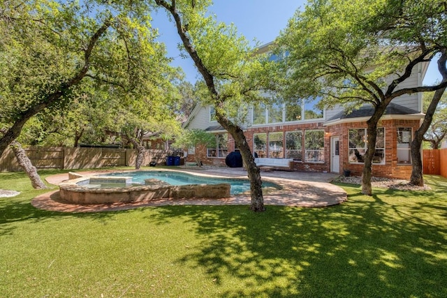 view of swimming pool with a fenced in pool, a lawn, and a fenced backyard