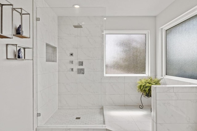 full bathroom with a tile shower